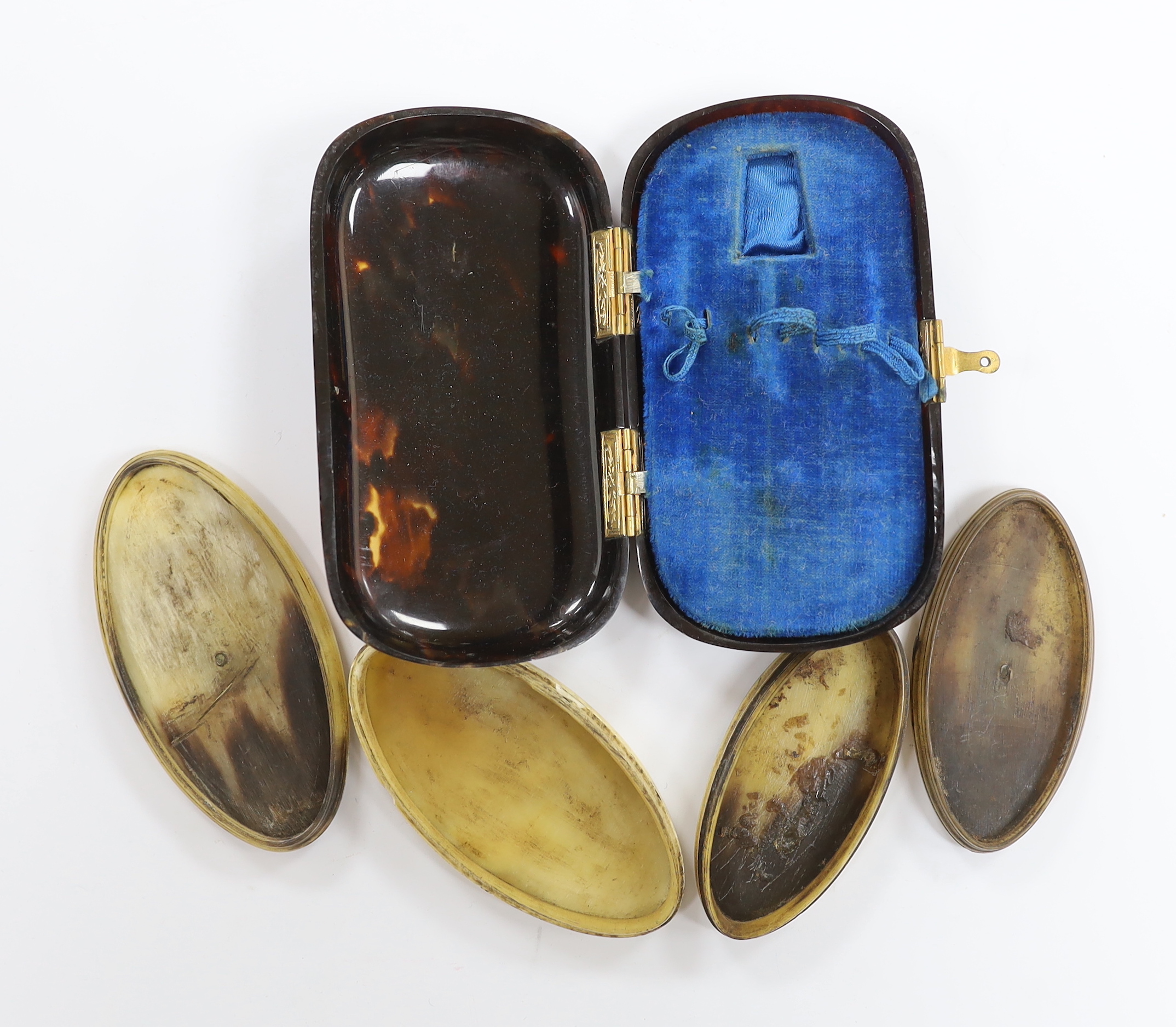 Two pressed horn cases and a tortoiseshell case, longest 11cm